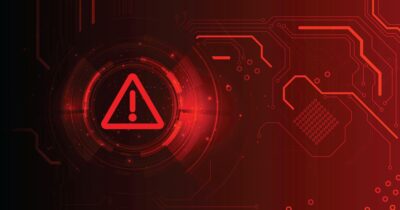 Punainen digitaalinen varoituskuvake: huutomerkillä varustettu kolmio ja piirikaaviomaisia kuviota, kuva symboloi Ulosottolaitoksen ja Suomi.fi:n nimissä lähetettyjä huijausviestejä.